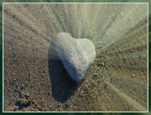 sun beams on rock shaped heart